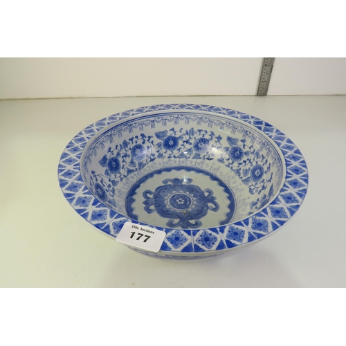 177 - A chinese blue and white large porcelain bowl painted with houses and pergolas outer and inner with ... 