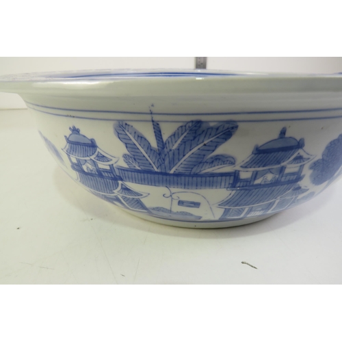 177 - A chinese blue and white large porcelain bowl painted with houses and pergolas outer and inner with ... 