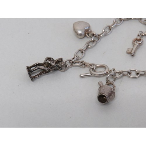 171 - Silver Charm Bracelet with Seven Charms