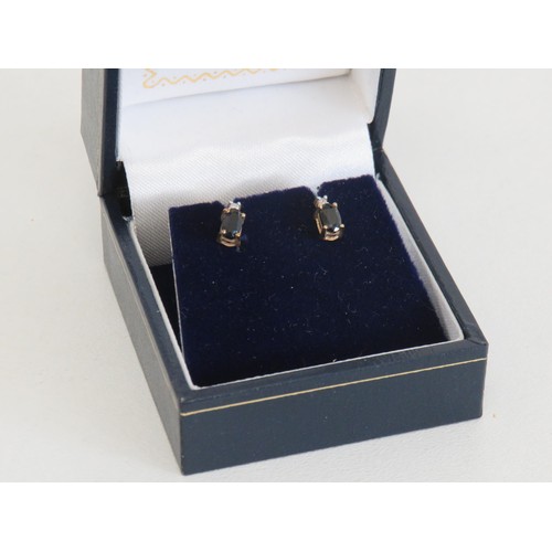 72 - 9ct Gold Sapphire and Diamond stud earrings with box. Weight 0.9g