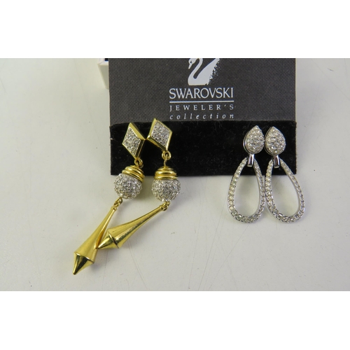 163 - Swarovski vintage gold tone dolphin necklace and two pairs of swarovski dangle earrings in presentat... 