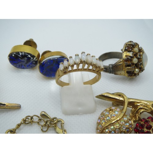 69 - Jewellery to include Australian Opal brooches, opalite, Swarovski scarab beetle etc.