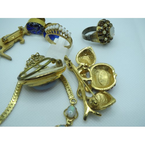 69 - Jewellery to include Australian Opal brooches, opalite, Swarovski scarab beetle etc.