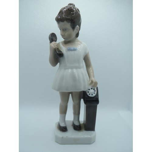 66 - Denmark Royal Copenhagen hand painted porcelain figurine of girl with telephone.
Height 17.5cms.