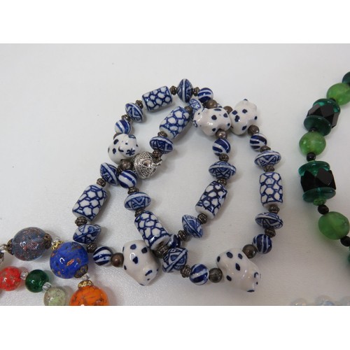 70 - Vintage glass and porcelain necklaces and bracelet.