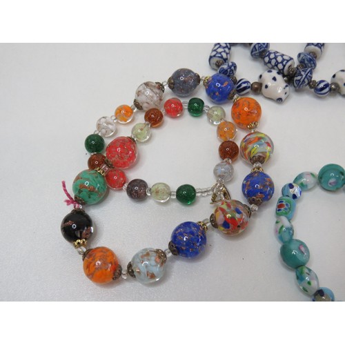 70 - Vintage glass and porcelain necklaces and bracelet.