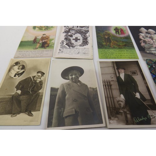 3 - Fifty vintage postcards including snake catcher, WWI bamforths, silk etc