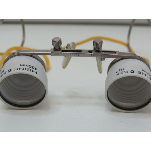 54 - A pair of Heine Dental & Surgical magnifying Loupes, C2.3 x 450mm