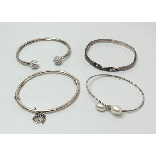 55 - Four 925 Silver bangles, total weight 37g