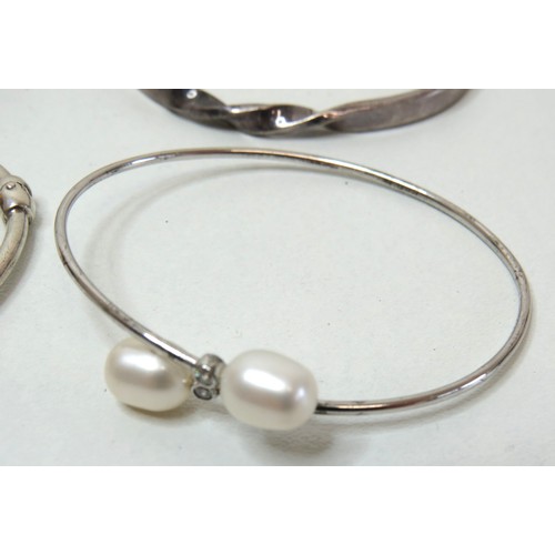 55 - Four 925 Silver bangles, total weight 37g