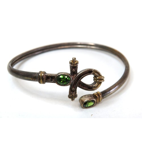 56 - Vintage Tsavorite silver bangle and Egyptian Eye of Horus silver bangle.
Weight 36.8g