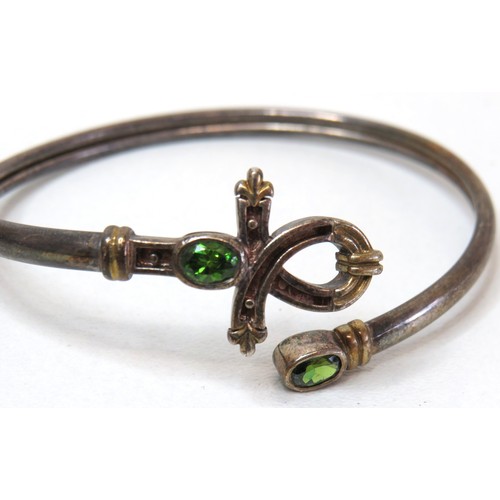 56 - Vintage Tsavorite silver bangle and Egyptian Eye of Horus silver bangle.
Weight 36.8g