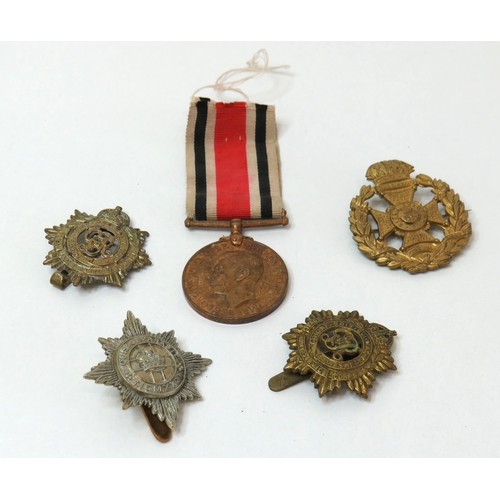 58 - WW2 Special Constabulary Long service medal to Fred.J.Oswald and four military cap badges.