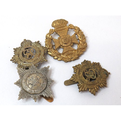 58 - WW2 Special Constabulary Long service medal to Fred.J.Oswald and four military cap badges.