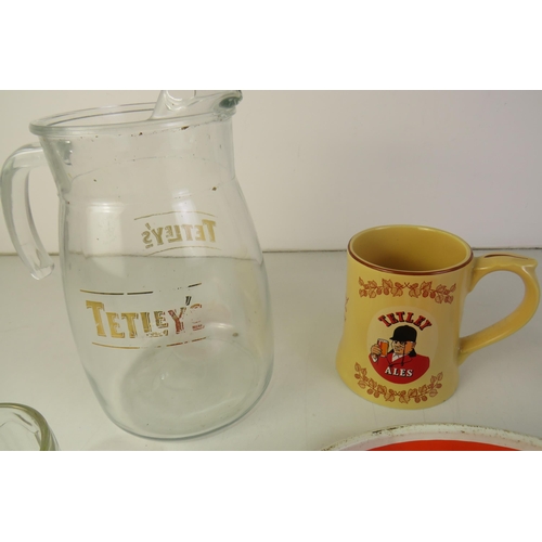 209 - Tetley collection including jug, three glasses, two ashtrays, tray and ceramic mug