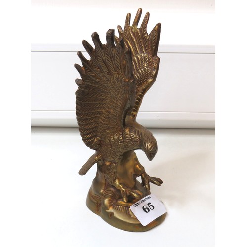 65 - Two brass eagle sculpture includes large solid brass eagle perched on a branch.