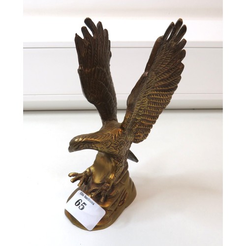 65 - Two brass eagle sculpture includes large solid brass eagle perched on a branch.