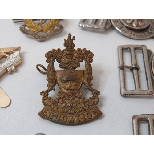 76 - Collection of Scout belt buckles, cap badge and trench art tie clip.