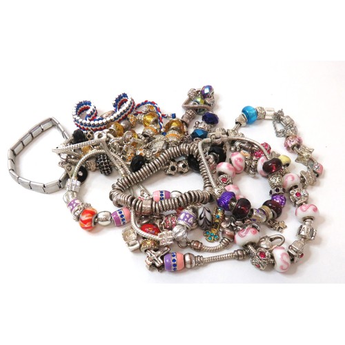 85 - Job lot of fashion charm bracelets.