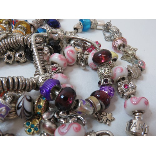 85 - Job lot of fashion charm bracelets.