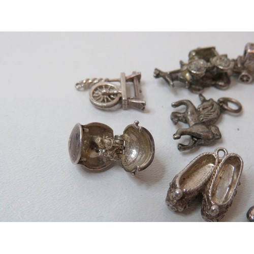 231 - Collection of vintage silver charms.