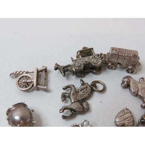 231 - Collection of vintage silver charms.