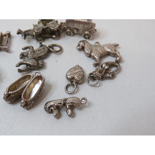 231 - Collection of vintage silver charms.