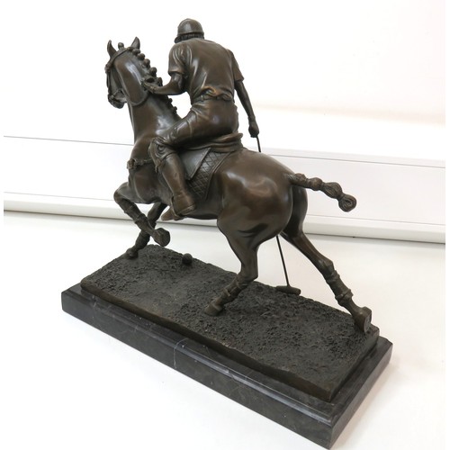 53 - Prince Charles playing polo a Hotcast signed bronze by the portuguese artist mitro on a solid marble... 