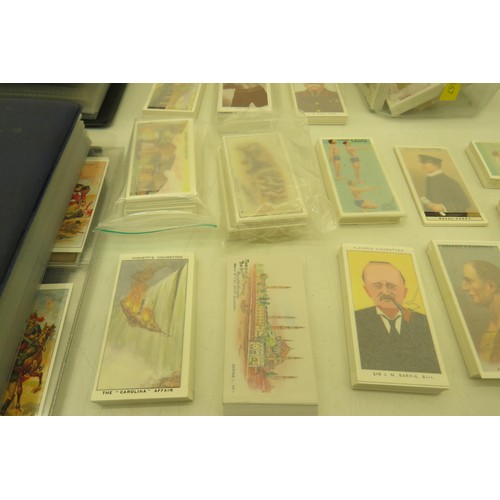 389 - Box of cigarette cards and two albums of re-prints