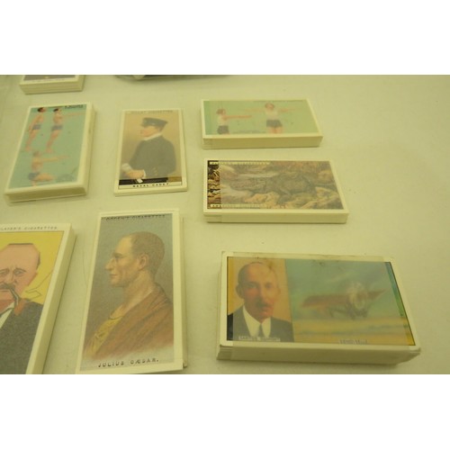 389 - Box of cigarette cards and two albums of re-prints