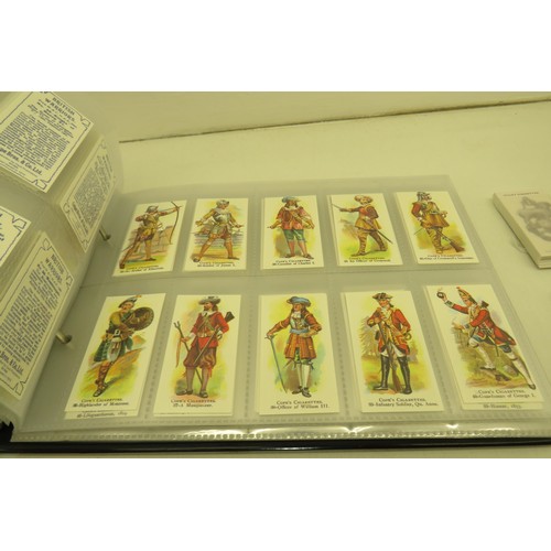 389 - Box of cigarette cards and two albums of re-prints