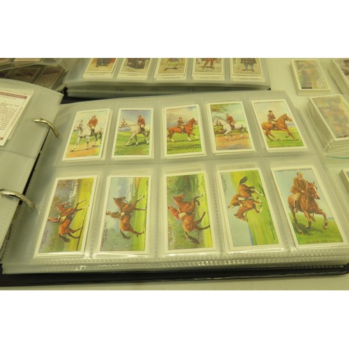 389 - Box of cigarette cards and two albums of re-prints