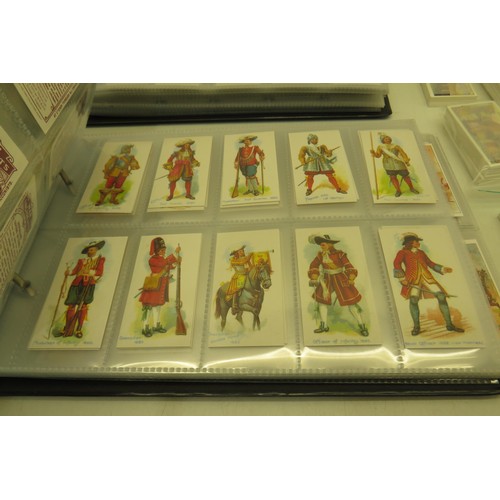 389 - Box of cigarette cards and two albums of re-prints