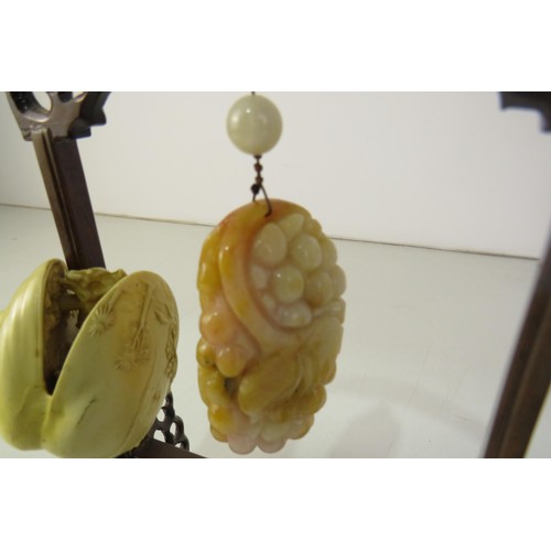 414 - Oriental stand with hanging gemstone and oriental shell scene