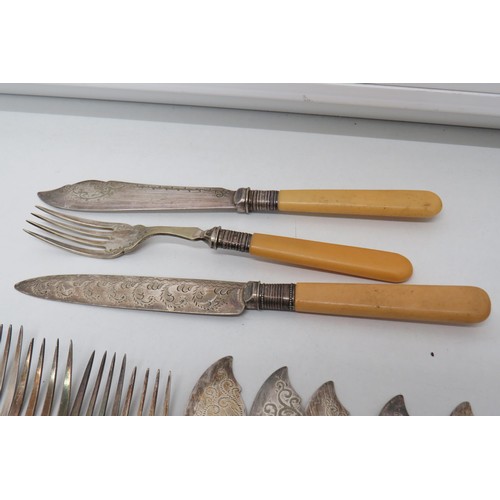 220 - Fish knifes and forks silver rimmed