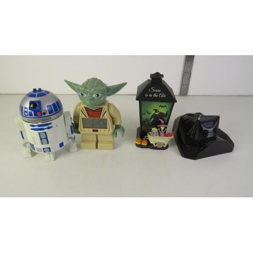 70 - Star Wars toys, Yoda alarm clock and Nightmare before Christmas toy.