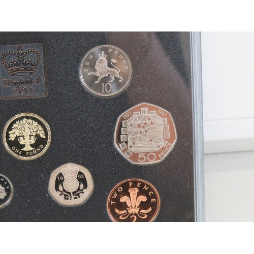 82 - 1992 UK Proof Coin Set collection with dual dated 1992/93 Fifty pence coin in blue folder.