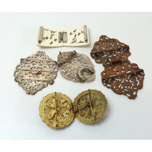 90 - Five vintage and antique belt buckles includes art deco celluloid, antique bronze nurse buckle etc.