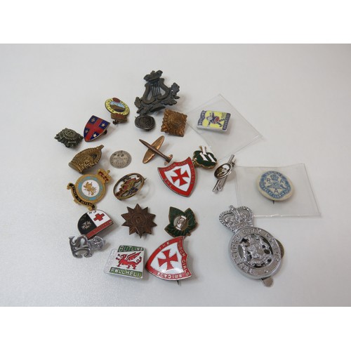 5 - Twenty-two old badges includes Military, Bradford Police, Butlins etc.