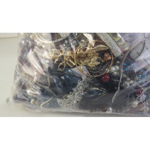 272 - 10kg bag of unsorted costume Jewellery.