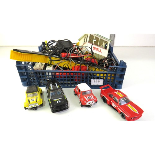 266 - Scalextric tracks, cars, power units and buildings.