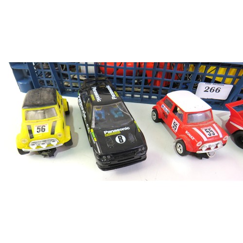 266 - Scalextric tracks, cars, power units and buildings.