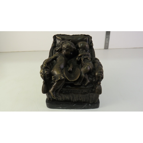 160 - Bronze boy and girl sitting on a chair