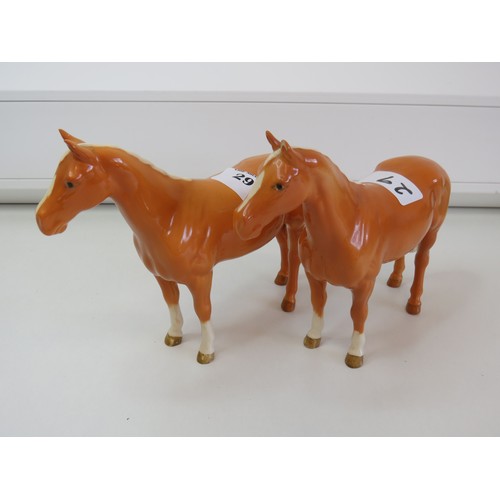 29 - A pair of Beswick Palomino horse figurines.