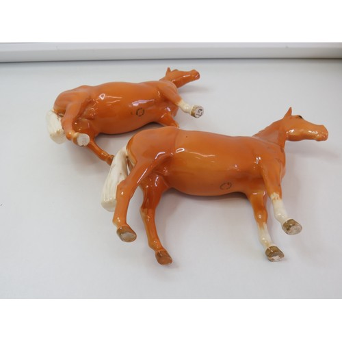 29 - A pair of Beswick Palomino horse figurines.