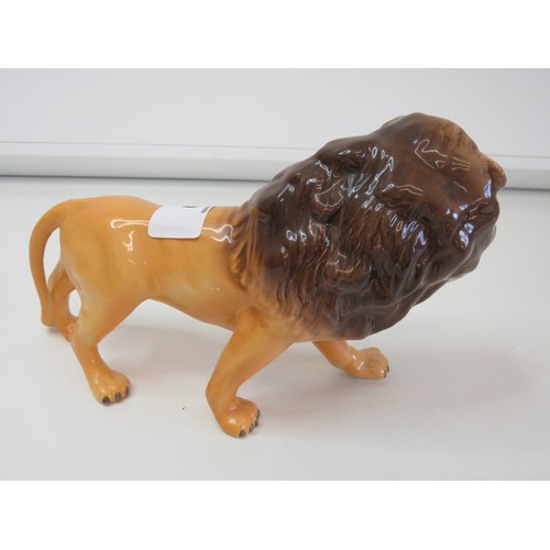 30 - Beswick prowling Lion figurine.