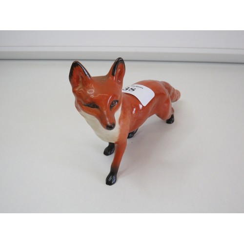 38 - Small and large size Beswick Fox figurines.