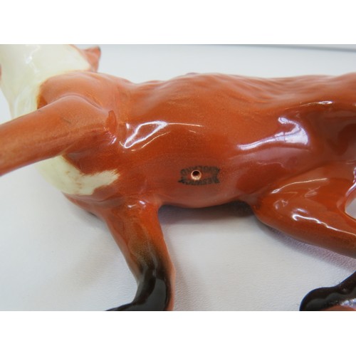 38 - Small and large size Beswick Fox figurines.