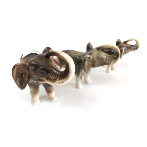 40 - Set of three Royal Dux elephant figurines.