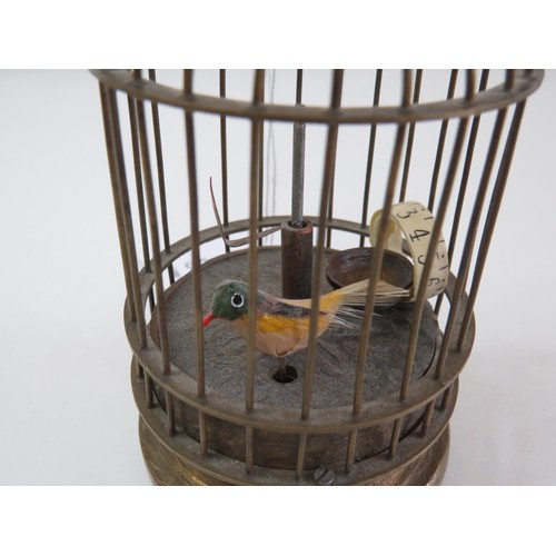 68 - Vintage novelty brass automation clock of a bird in a cage.